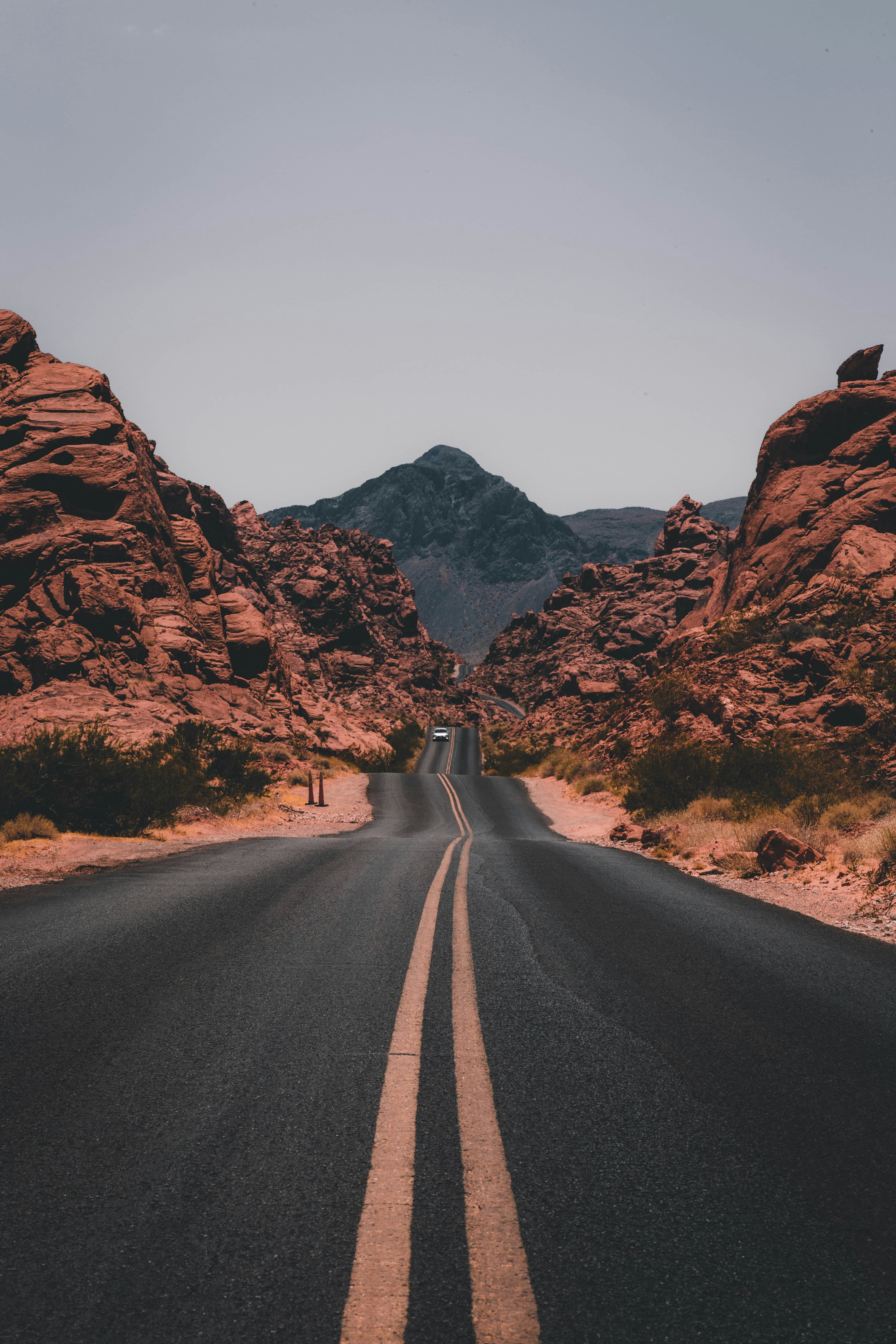 A warm road running through a desert landscape